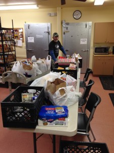 Jose, Main Street Association Volunteer, delivering food to the pantry